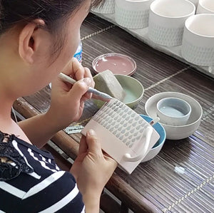 Image of the Vietnamese mugs being handpainted