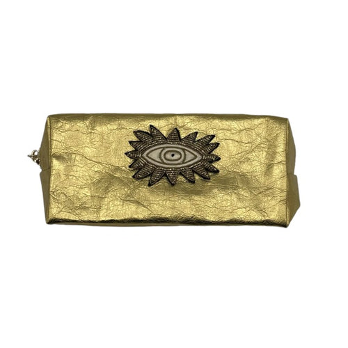 Luxury gold makeup bag with a bold sunshine eye motif 