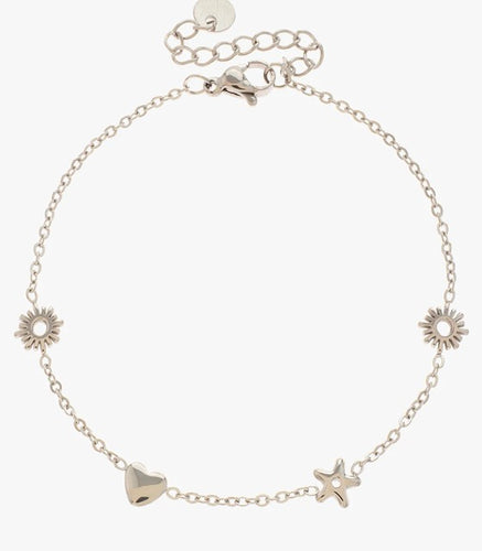 A delicate chain bracelet with sun, heart and star charms