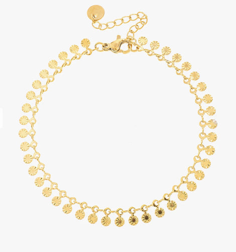 A delicate bracelet with tiny suns on it