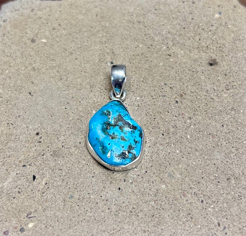 Turquoise pendant set in sterling silver