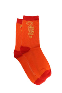 Bright orange bamboo socks with a prowling tiger in yellow and the toe, heal and rib in red