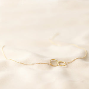 Brushed gold interlocking hoop necklace