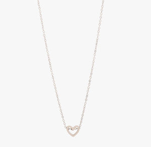 dainty open heart charm threaded onto a chain