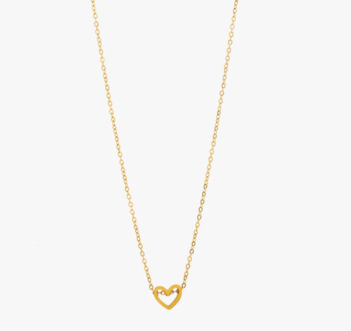 Tiny open heart charm threaded onto a gold chain necklace