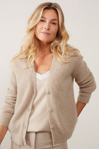 A fluffy taupe cardigan with a high content of mohair 32% and wool 32% which will make it so warm
