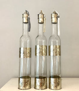 Hand decorated oil bottles with engraved metal made in Marrakech.