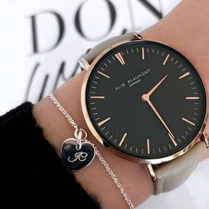 Fashion watch in black with pale grey strap