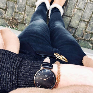 Classic style watch with black dial black strap rose gold casing