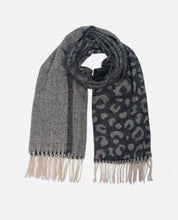 Load image into Gallery viewer, A lightweight and supersoft ladies scarf, featuring a black ombre design. With a large leopard print to one end, it gently fades to a plain design to the other end. With warm cream tassels to each end. 