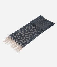 Load image into Gallery viewer, A lightweight and supersoft ladies scarf, featuring a black ombre design. With a large leopard print to one end, it gently fades to a plain design to the other end. With warm cream tassels to each end.