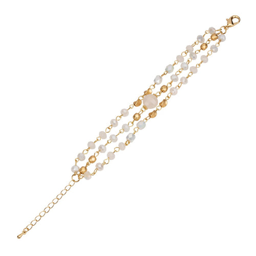 Triple strand bracelet of white and gold crystals on a gold chain.