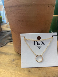 Double layer circle necklace in a gold colour. Get the layered look but in one necklace. One chain features a dainty ball chain detail, and the other has the fine circle pendant. Clasp fastening and extender chain so you can choose your fit. Short in length.