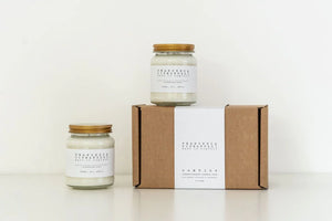 A set of two aromatherapy candles in sustainable packaging