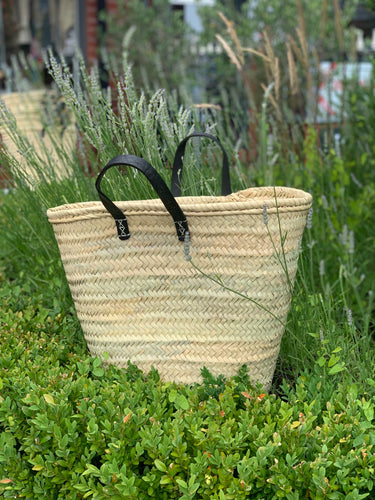 Large sturdy basket with stitched on black leather handles