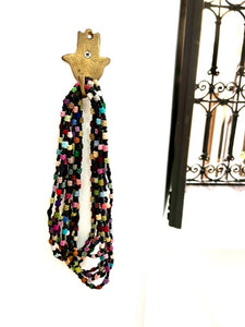 Multi coloured necklaces made from cactus silk mixed with black beads