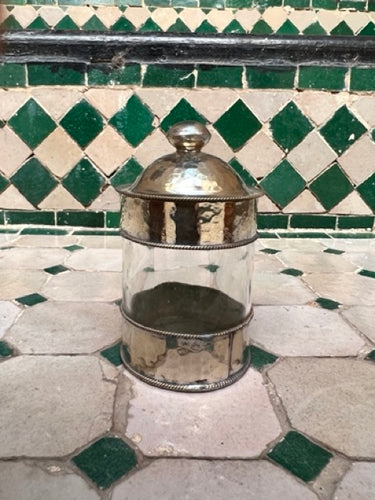 A recycled glass and metal small storage pot handmade in Marrakech with beautiful Moroccan detail.
