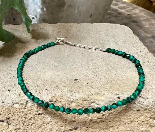 A fine sparkly green quartz bracelet with sterling silver extender chain and s hook closure