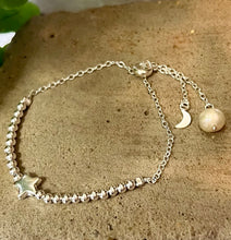 Load image into Gallery viewer, A sterling silver beaded  bracelet with a star  and a moon and pearl at the ends of the chain