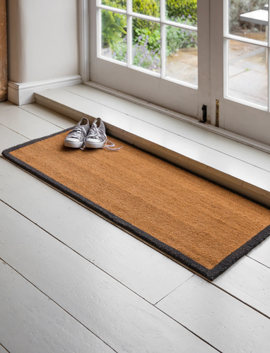 Double length coir door mat with a charcoal surround.