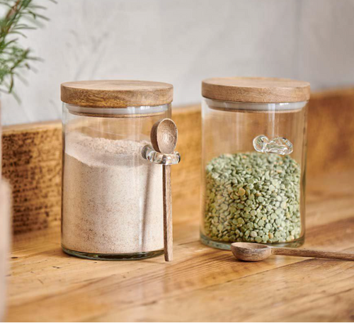 Glass storage jars with mango lids and a mango spoon. Sustainable living jars