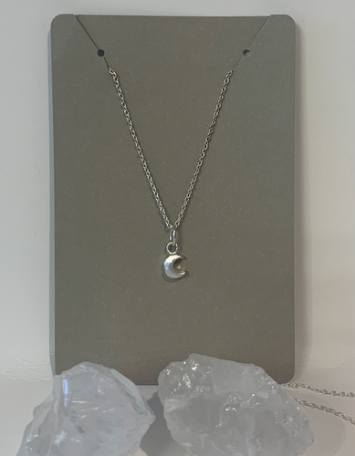 Tiny moon charm on a delicate 18 inch silver chain. Sterling Silver