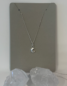 Tiny moon charm on a delicate 18 inch silver chain. Sterling Silver