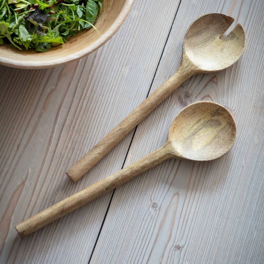 Hand crafted textured mango salad servers. One spoon has a round end, the other has a slot in it