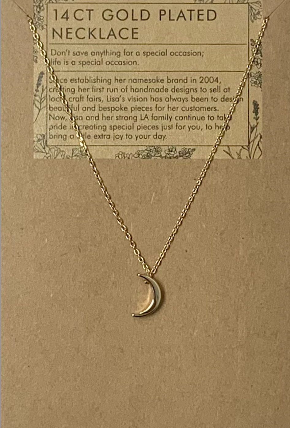 Delicate crescent moon on a fine gold chain. 