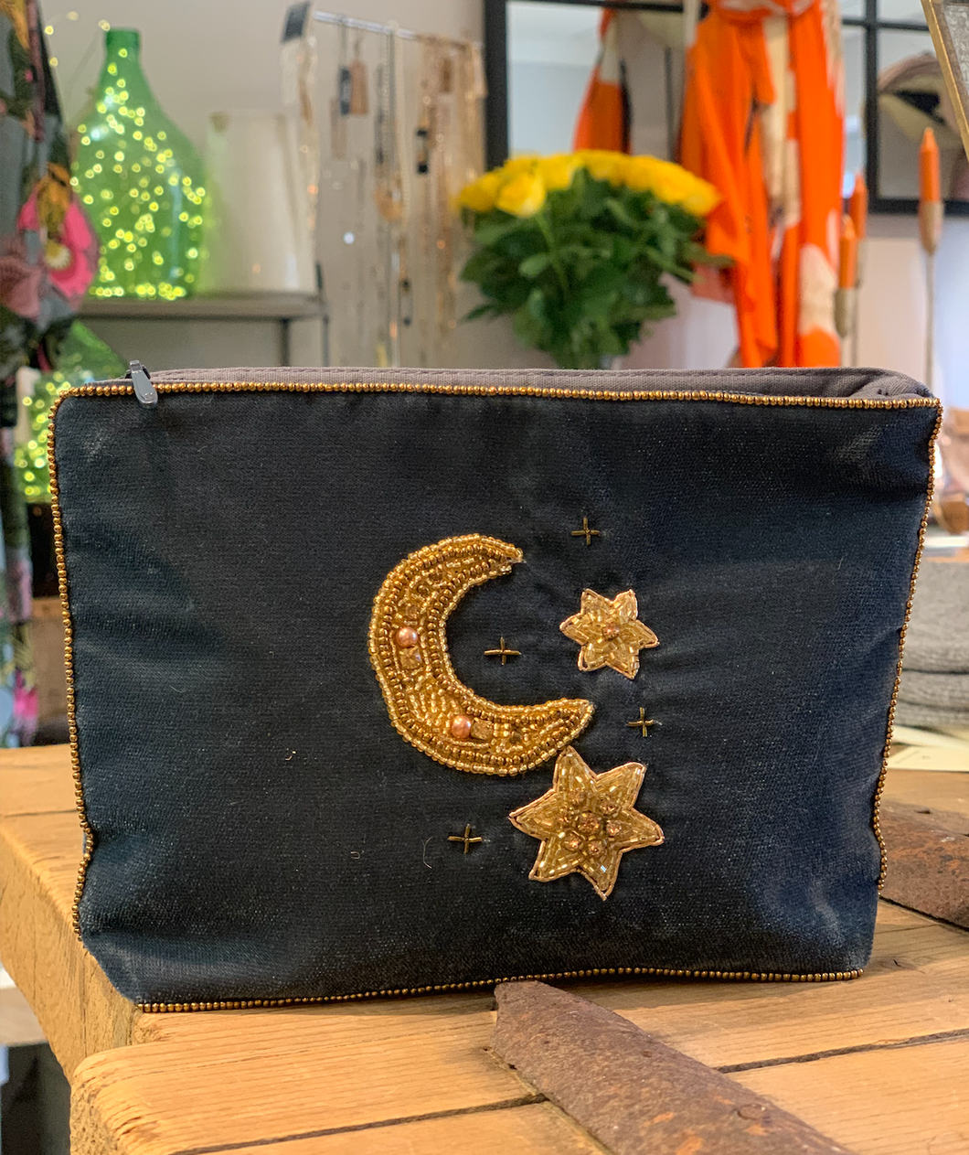 large velvet purse with a flat bottom embroidered with a mix of  beads sparkles and shiny gold beads