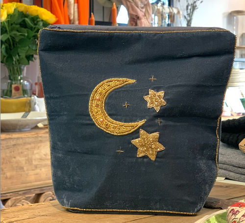 A generous sized velvet makeup bag that will stand up as it has a flat bottom with beautiful gold moon and stars embroidered