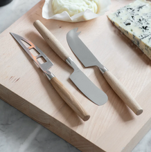 Load image into Gallery viewer, A set of three cheese knives crafted from oak and stainless steel