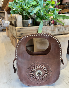 Brown handbag with circular design 