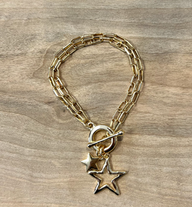 Gold plated chain bracelet with a toggle fastening and two pretty star pendants