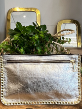 Load image into Gallery viewer, Silver leather bag with chain strap and a line of brass studs around the edge