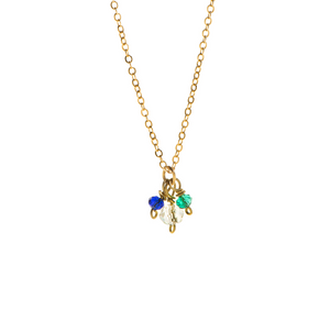 Inspired by the colours of Indian temples this beaded necklace has three sea coloured stones on brass wire and added to a gold plated chain
