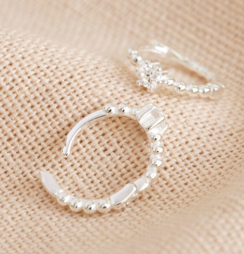 small sterling silver huggie hoops with a crystal