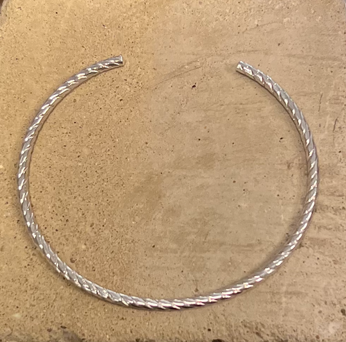 Twisted sterling silver cuff bracelet with a texture