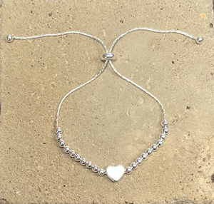 sterling silver bracelet with small heart and beads on a snake chain
