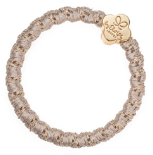 Load image into Gallery viewer, Woven gold hair band with gold flower charm
