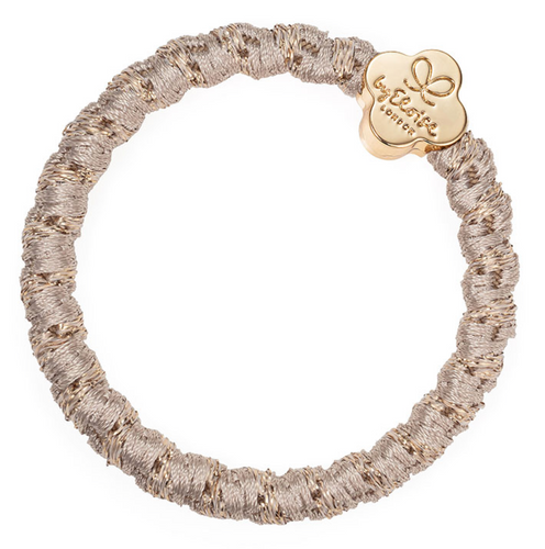 Woven gold hair band with gold flower charm