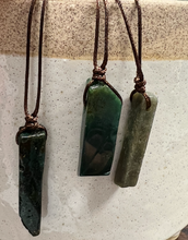 Load image into Gallery viewer, A deep green stone on a brown adjustable cord