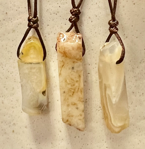 Yellow agate crystal pendants - a creamy yellow stone with lots of benefits on a brown cord adjustable cord