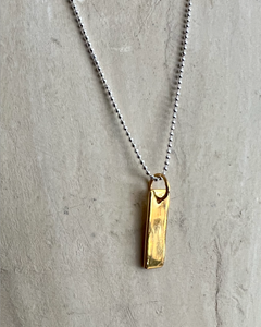 A fine gold plated rectangular tag on a sterling silver fine ball chain.