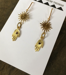 delicate handmade brass hand and star dangling earrings have a star on one hand and a heart on the other and a beautiful sunshine above. On gold plated hooks