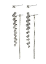 Load image into Gallery viewer, A 2 in 1 earring set from Pilgrim. The set compromises of a crystal stud, and another pair which is long and elegant, featuring a drop wavey crystal pendant measuring 3cm in length, and at the back there is a delicate chain which hangs to create a soft elegant look. Silver plated. 