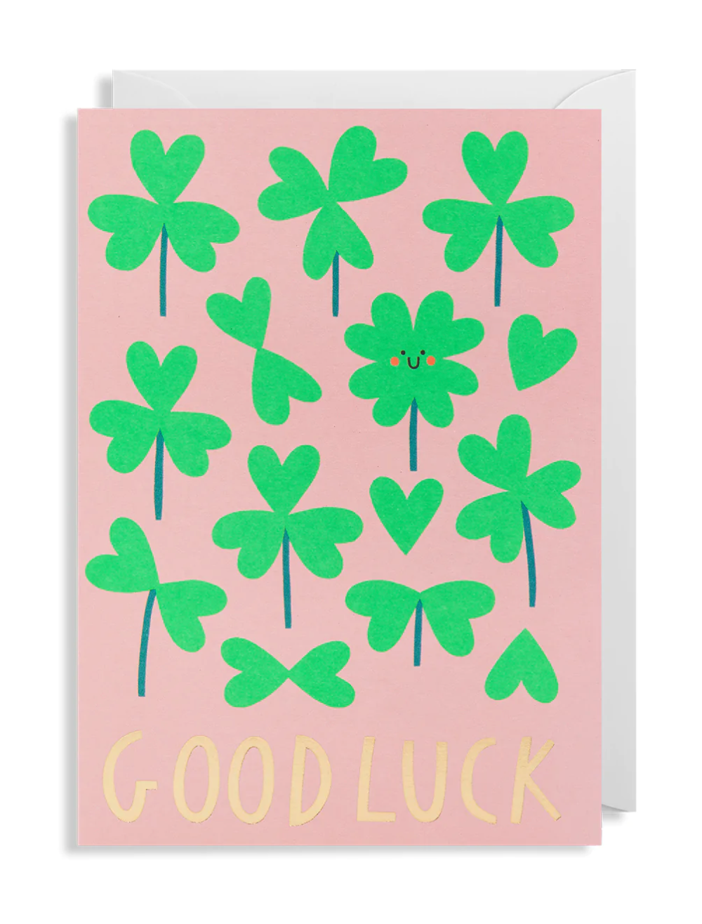 A Good Luck card in pink with lots of green shamrocks and the word s Good Luck in gold.
