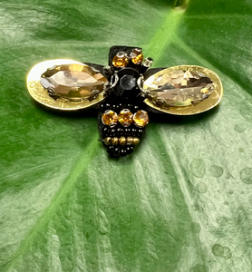 A bumble bee broach made from a selection of sparkly gems
