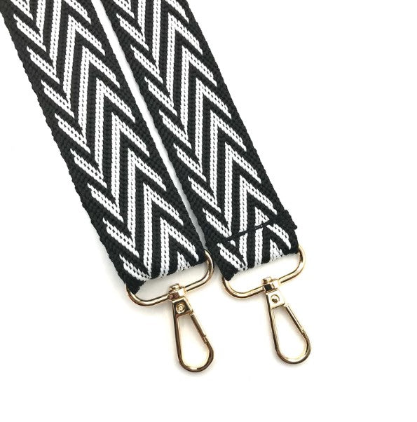 This detachable bag strap is woven recycled nylon, in a black and white chevron design. With gold coloured hardware to the ends with a gold coloured clasp so you can attach this strap to your handbag. 
