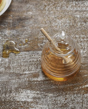Load image into Gallery viewer, a ridged glass honey pot with a lid. a beech dibber comes with to complete the set, and to drizzle your honey with ease. 